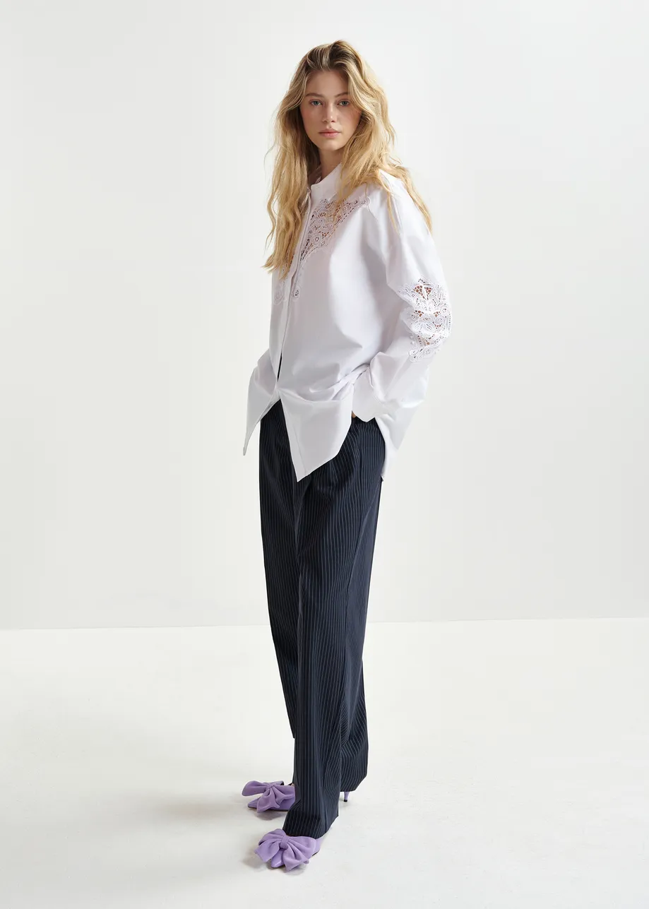 Dark blue and white pinstriped tapered leg pants