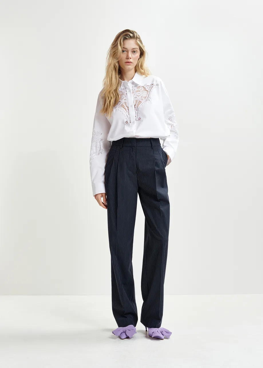 Dark blue and white pinstriped tapered leg pants