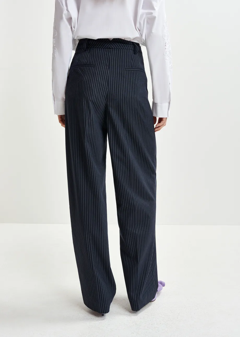 Dark blue and white pinstriped tapered leg pants