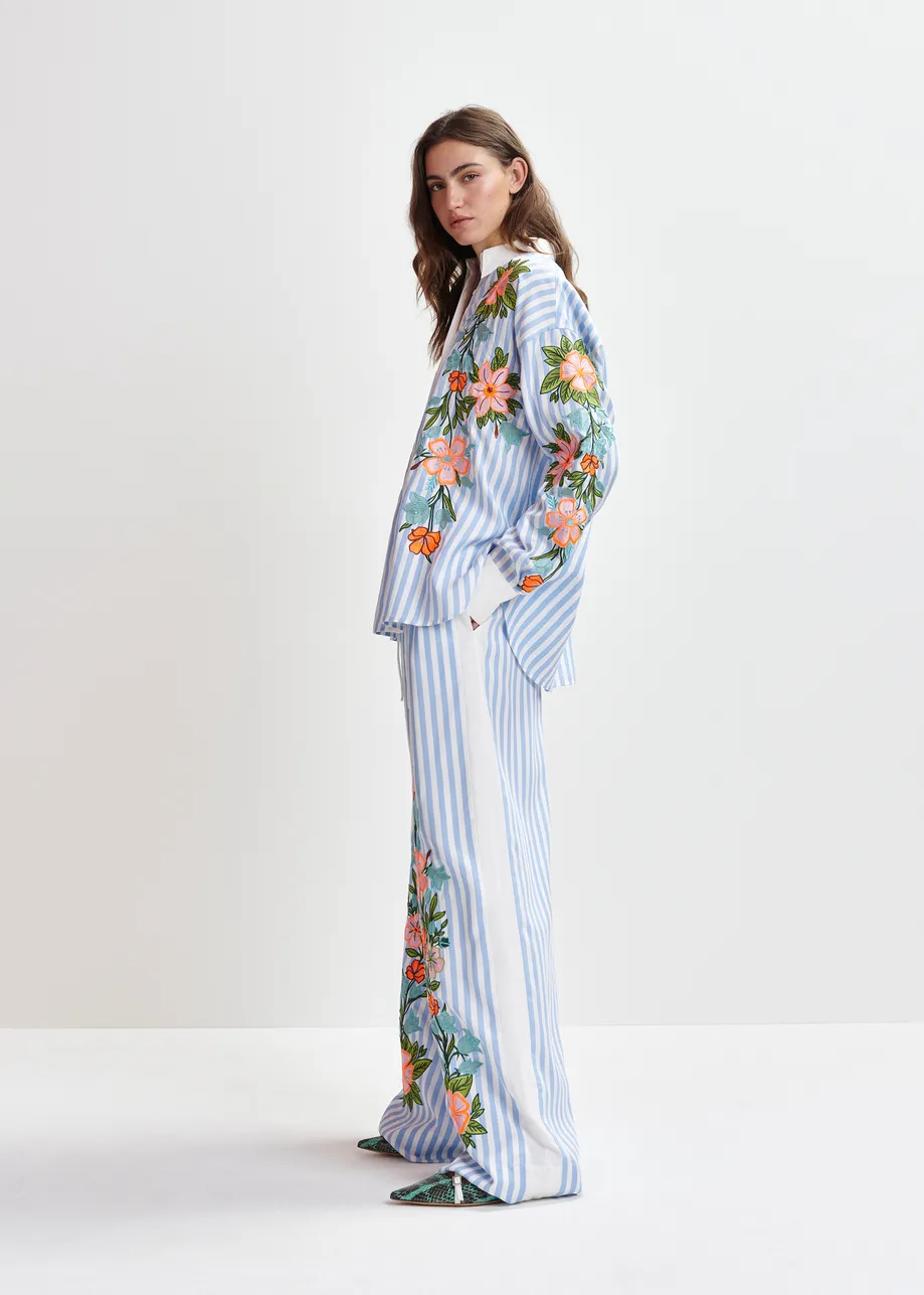 Blue, white and multicolored wide-leg pants with contrast border and embroideries