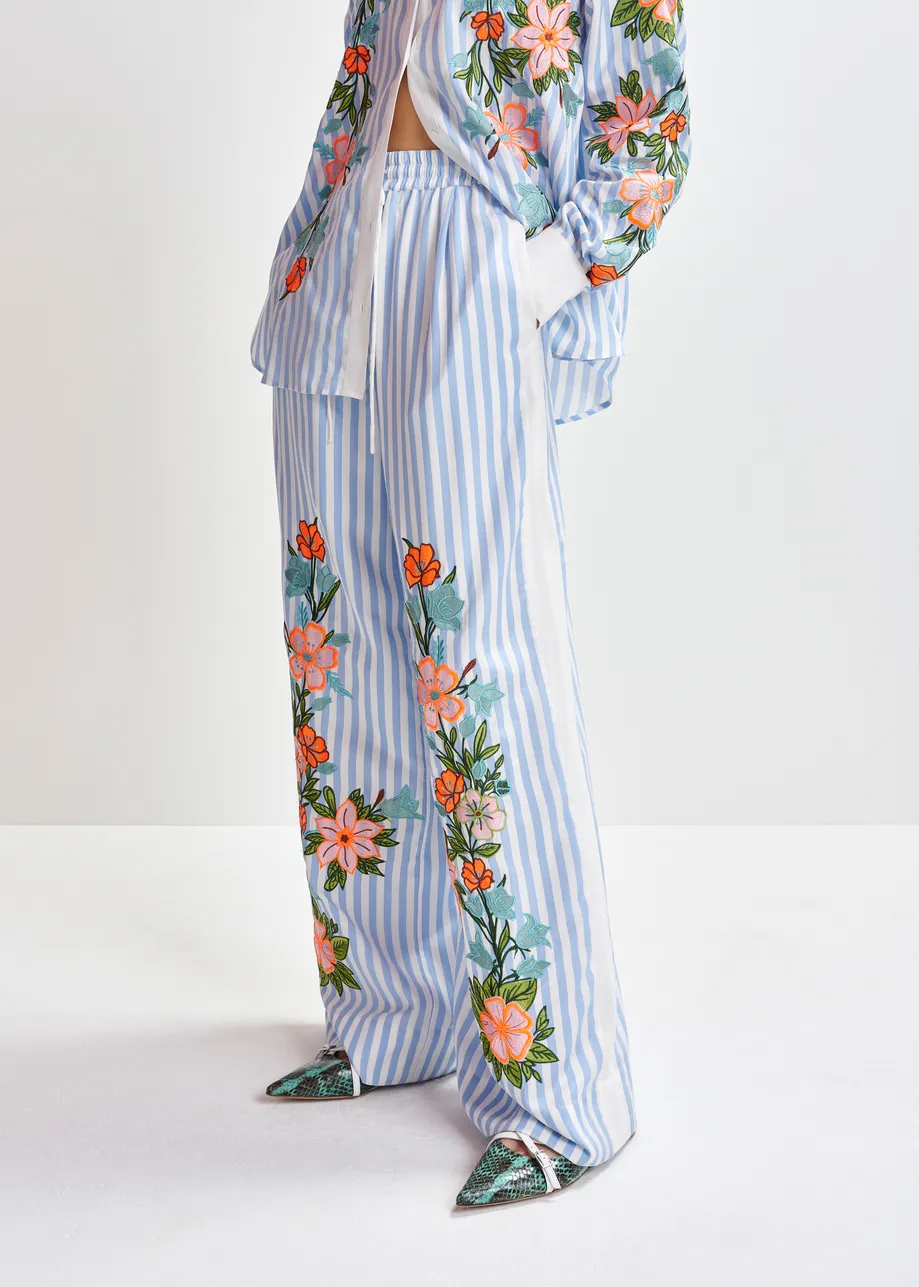 Blue, white and multicolored wide-leg pants with contrast border and embroideries