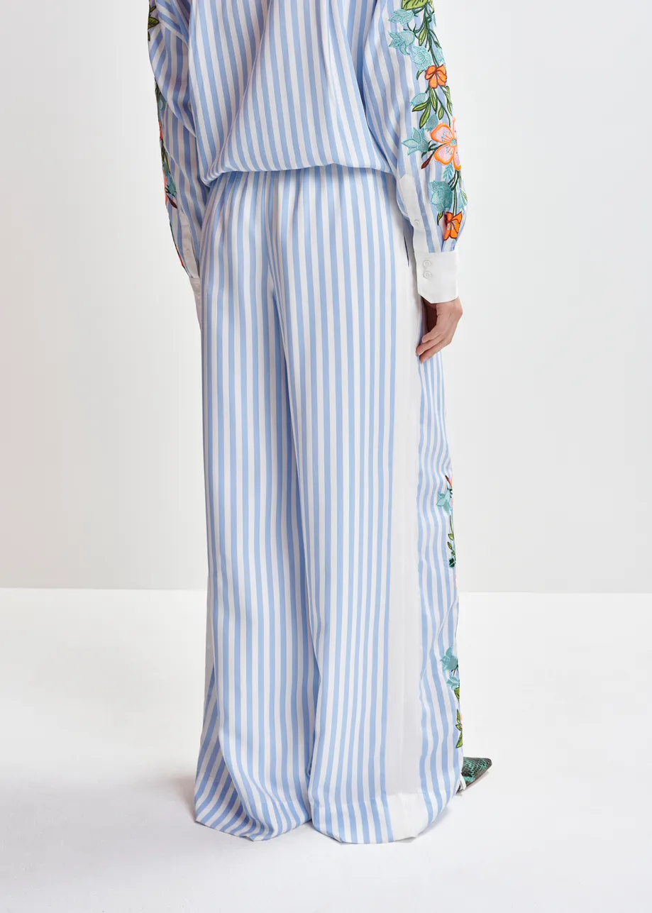 Blue, white and multicolored wide-leg pants with contrast border and embroideries
