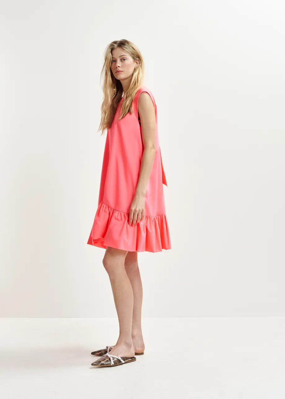 Coral ruffled mini dress with open-back and bow detail