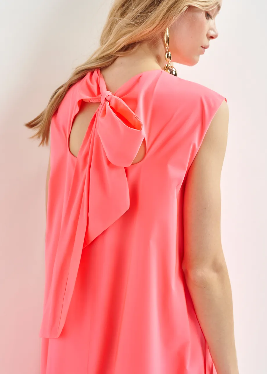 Coral ruffled mini dress with open-back and bow detail