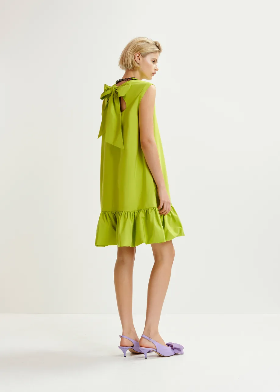 Green ruffled mini dress with open-back and bow detail