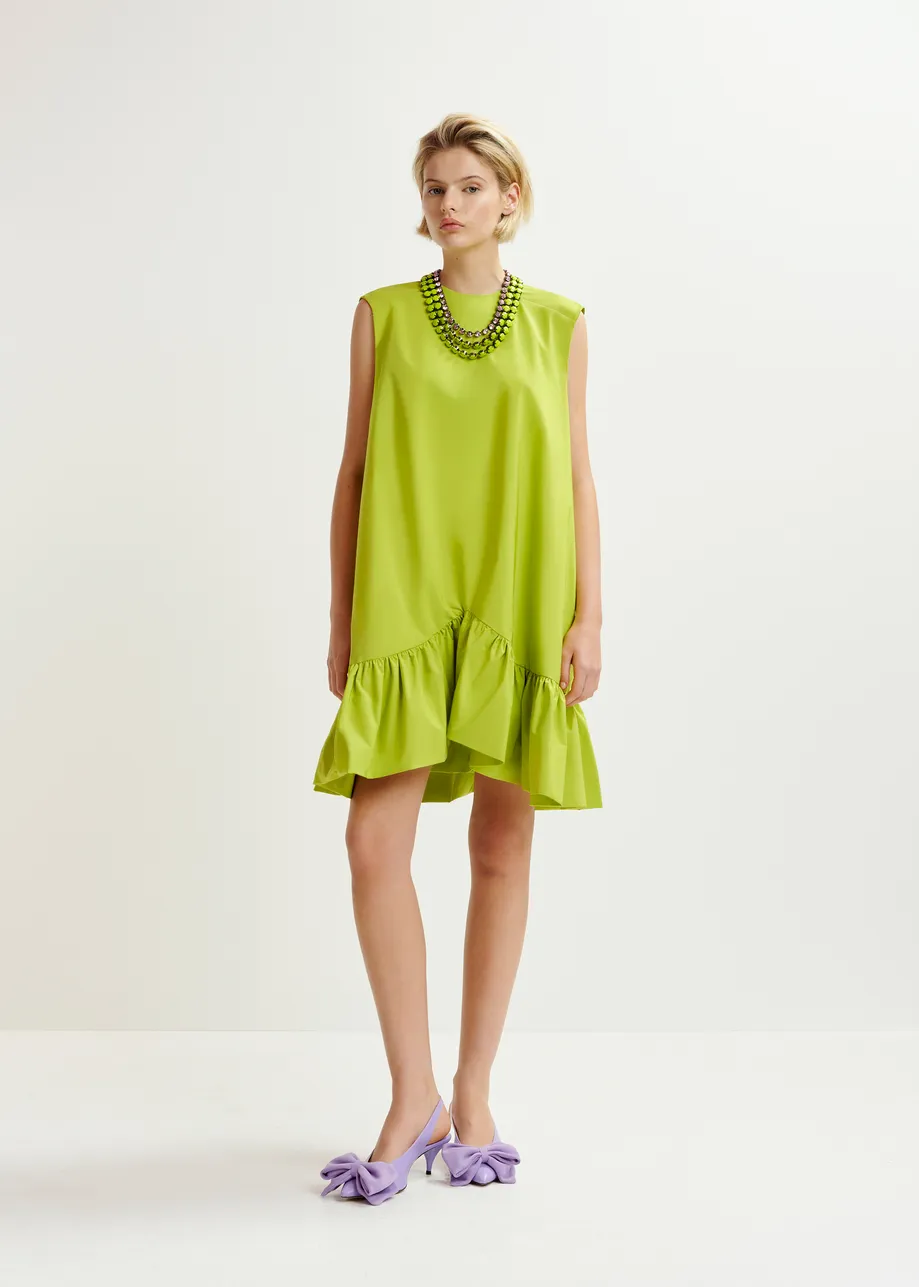 Green ruffled mini dress with open-back and bow detail