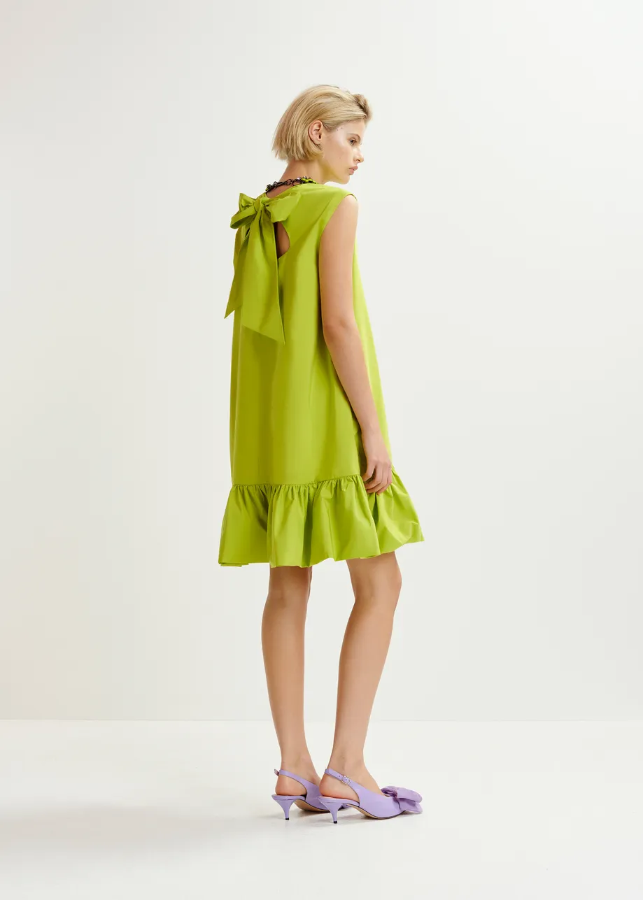 Green ruffled mini dress with open-back and bow detail