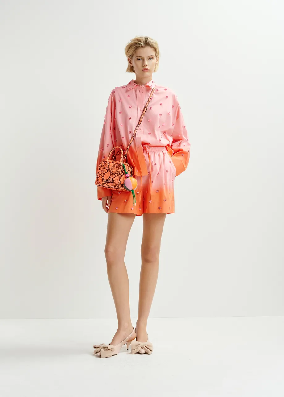 Pink and orange ombré shorts with sequin and bead flower embellishments