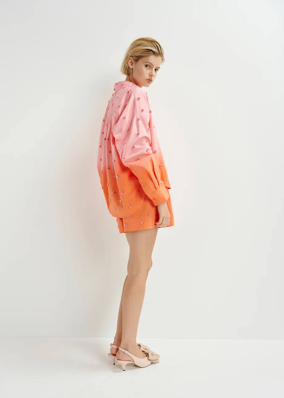 Pink and orange ombré shorts with sequin and bead flower embellishments