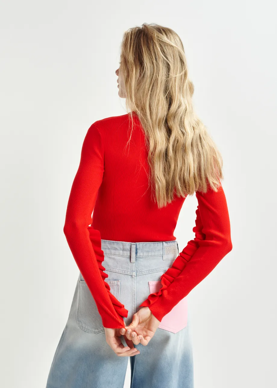 Pull en maille rouge à volants