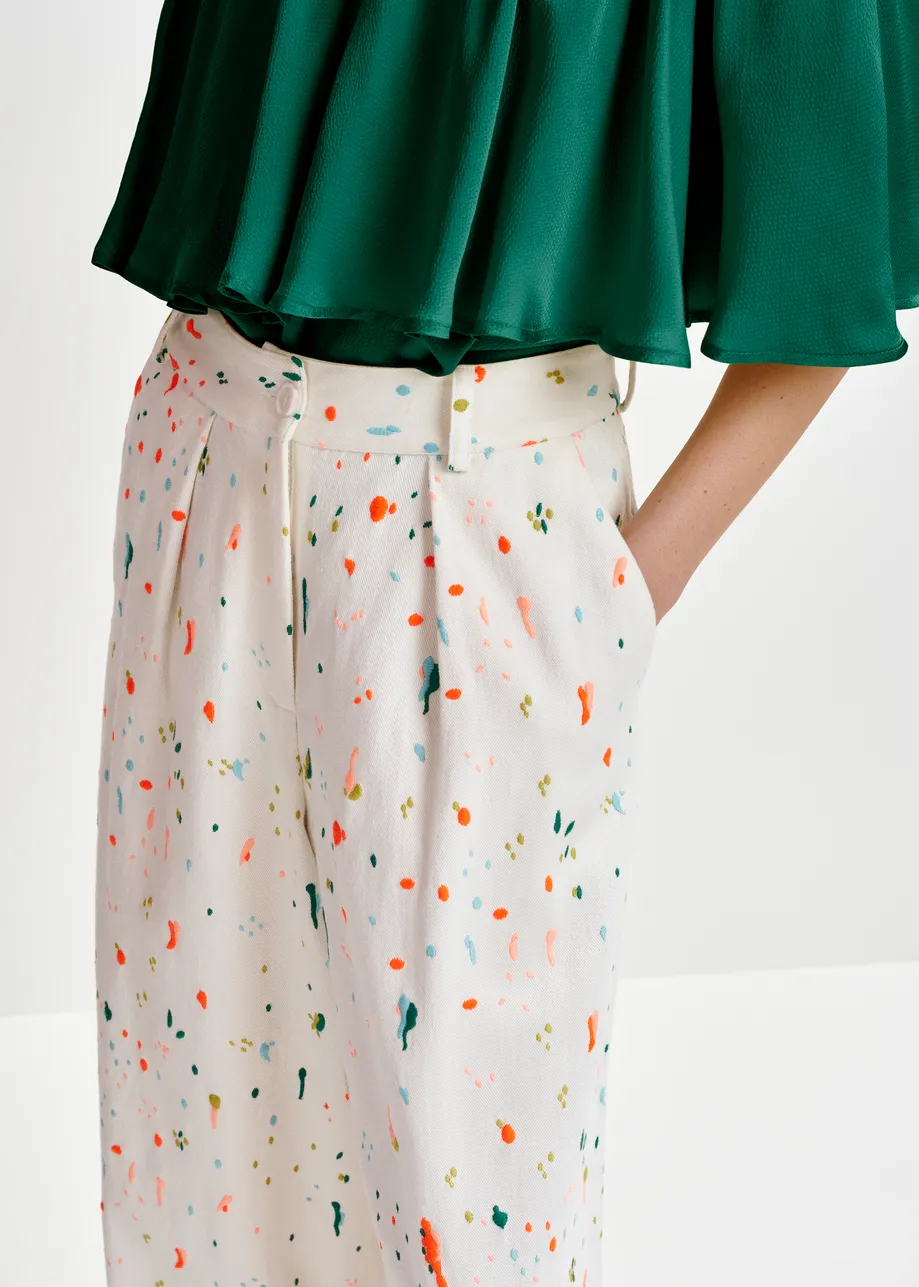 Off-white and multicolor wide-leg pants with embroidered paint splatters