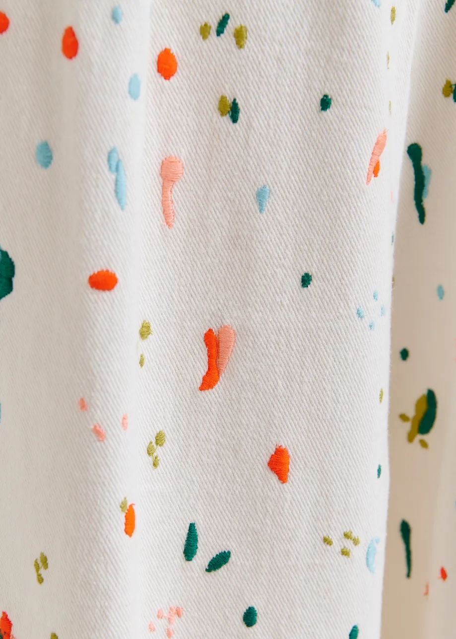 Off-white and multicolor wide-leg pants with embroidered paint splatters
