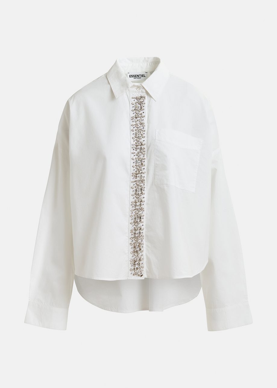 Chemise en coton blanche avec ornements à la patte de boutonnage