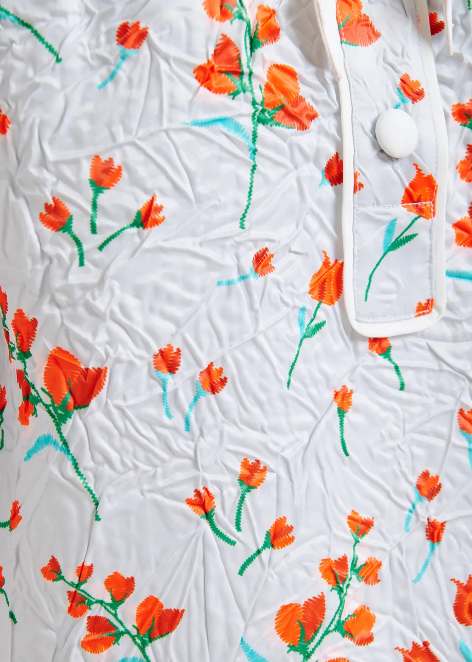 Gebroken witte mini-jurk met bloemenprint en strik