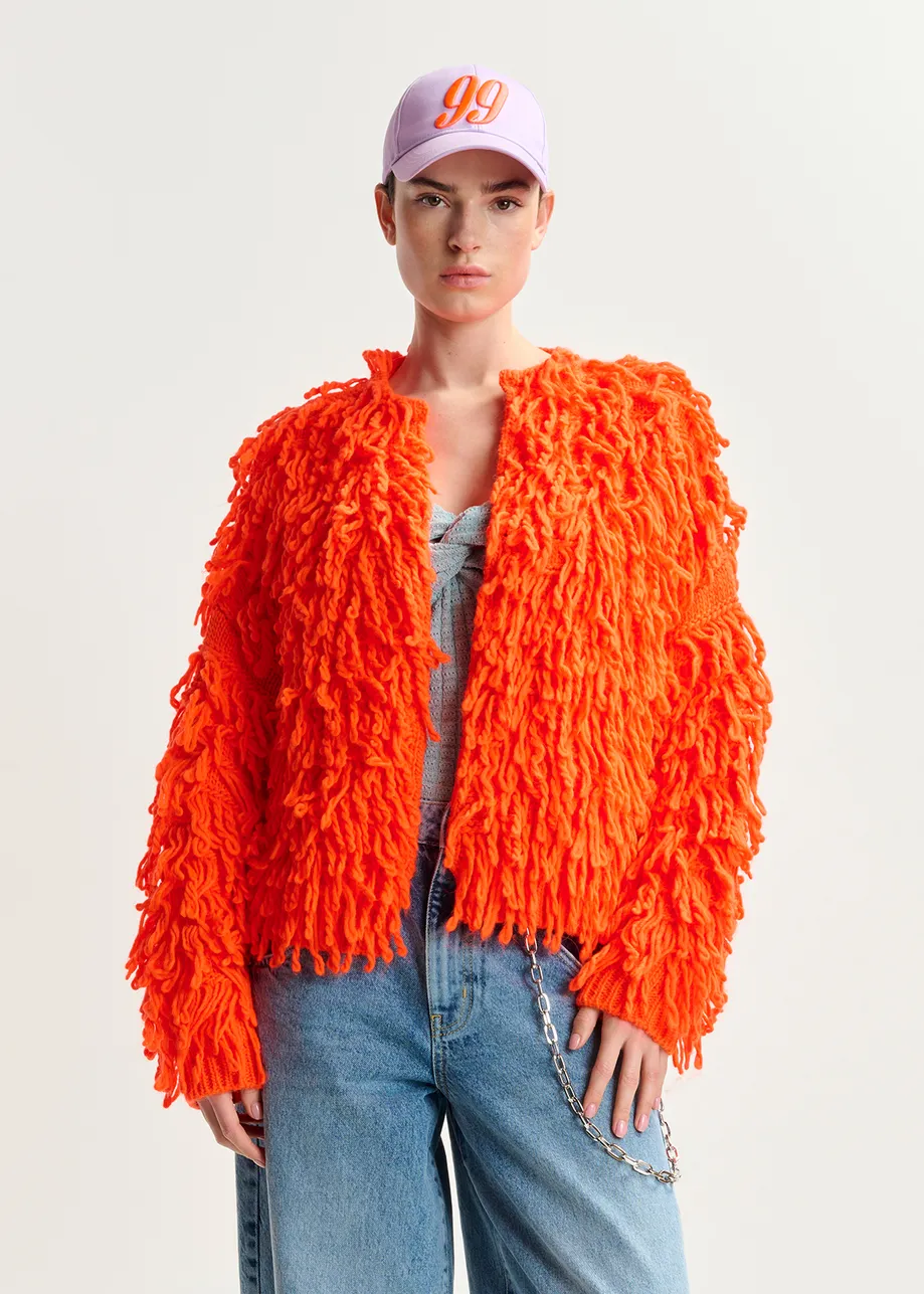 Tricot oversize orange vif en maille bouclée