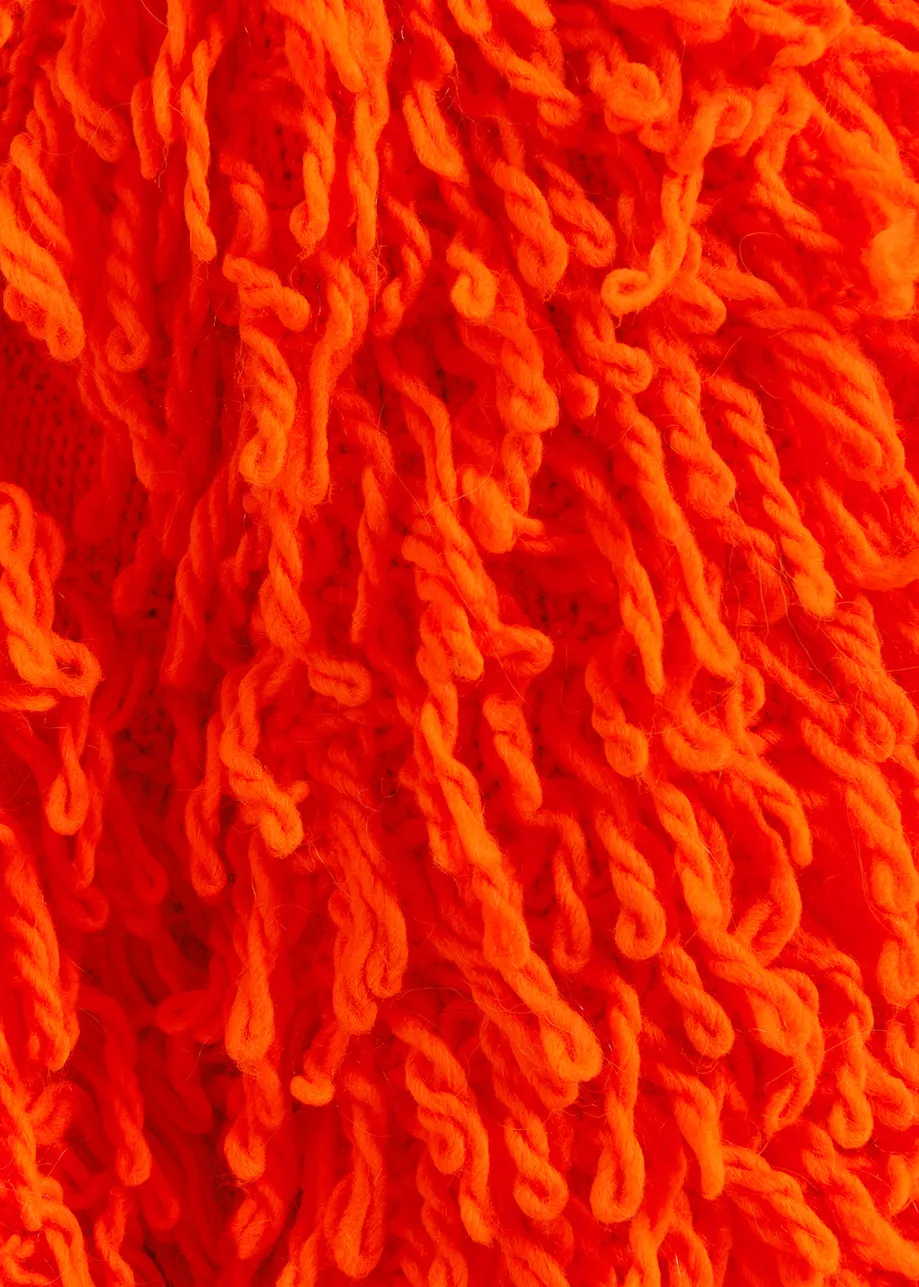 Tricot oversize orange vif en maille bouclée