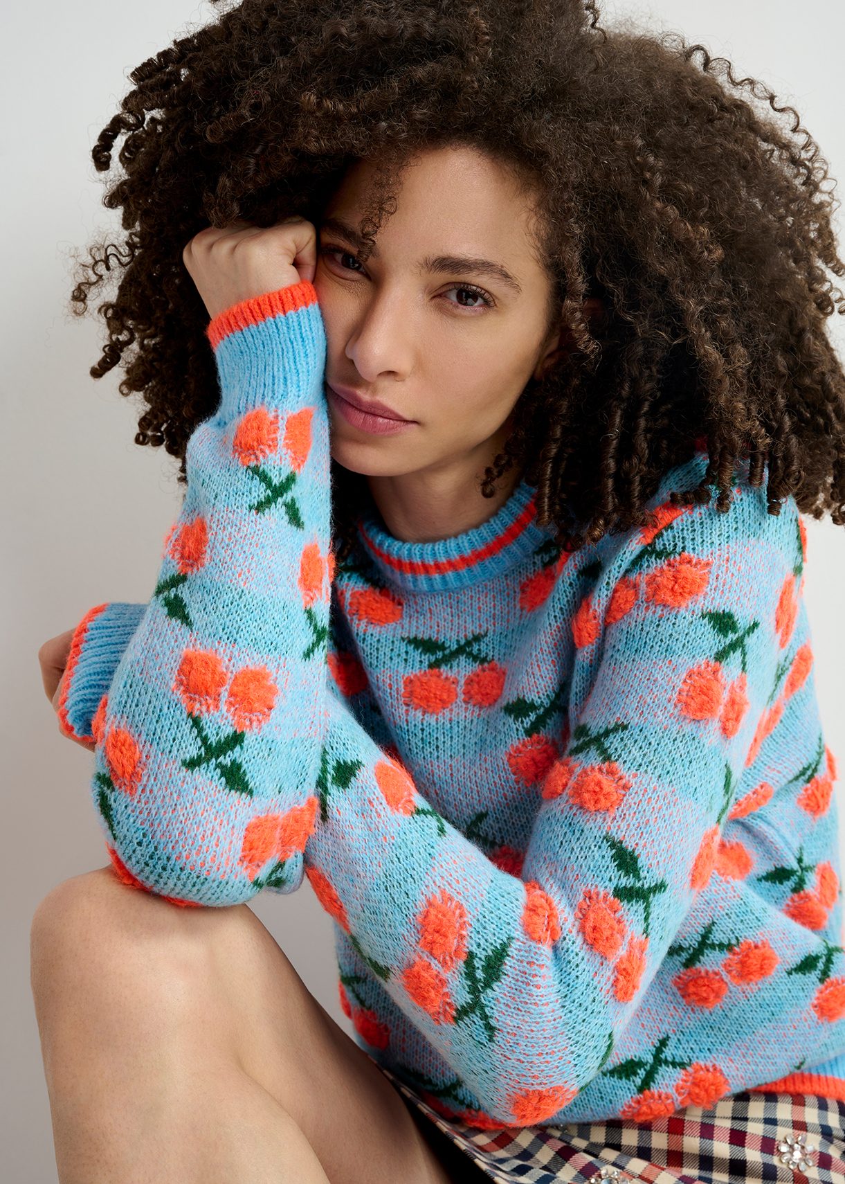 Blue and orange intarsia knitted sweater with cherry pattern