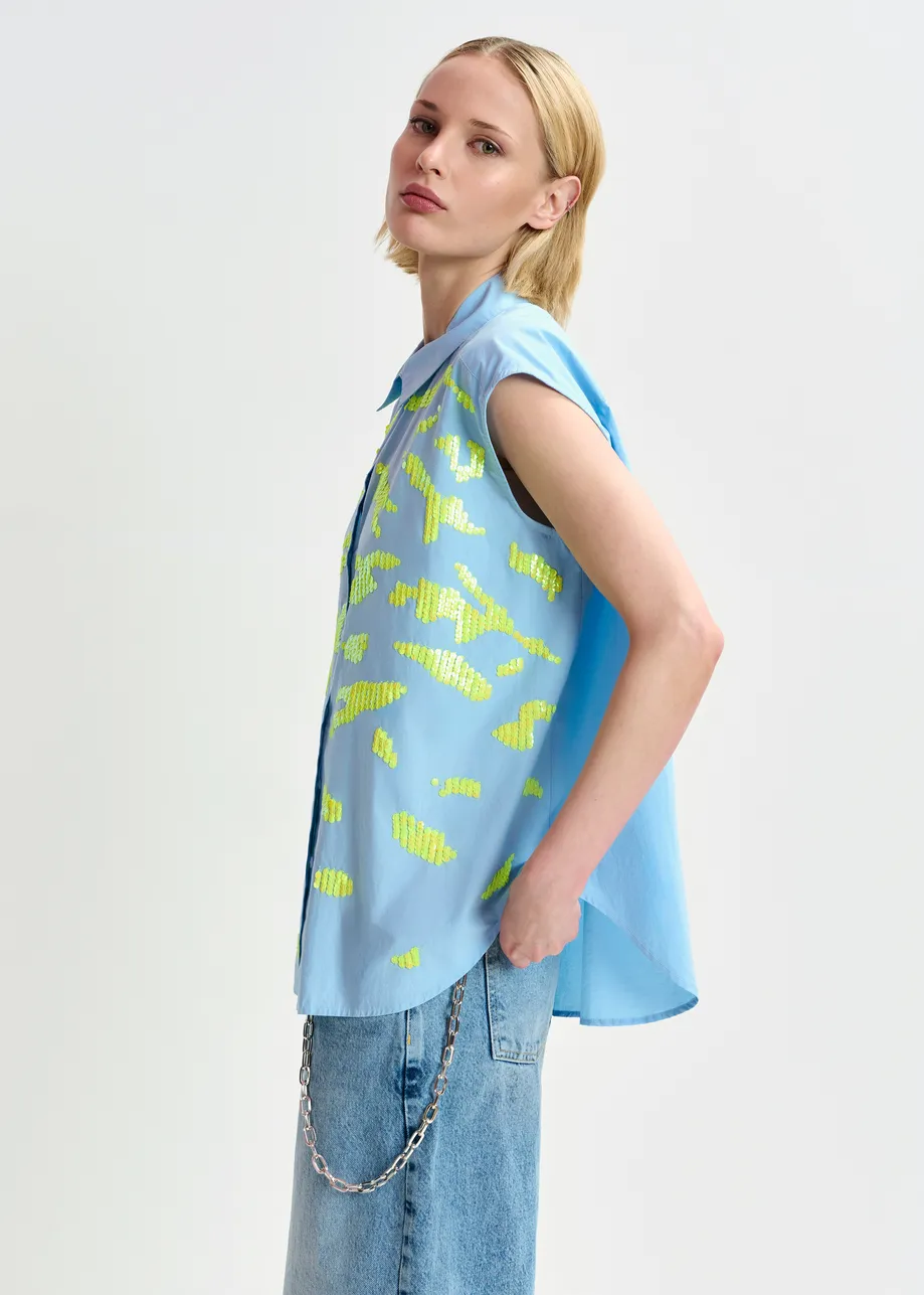 Light blue and yellow sleeveless cotton shirt with embellishments