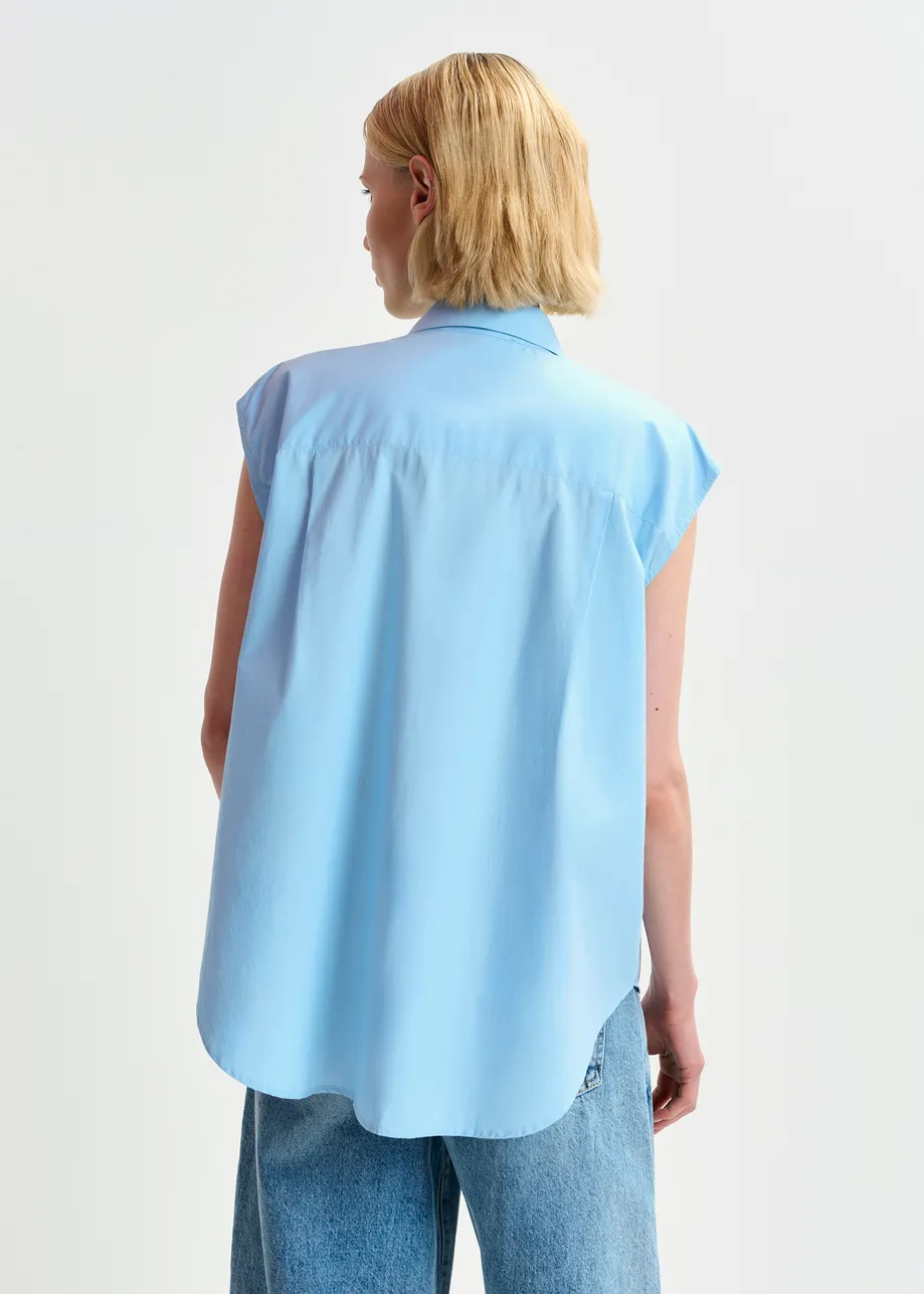 Light blue and yellow sleeveless cotton shirt with embellishments