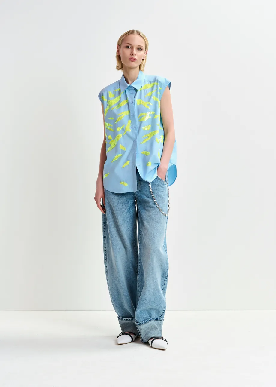 Light blue and yellow sleeveless cotton shirt with embellishments