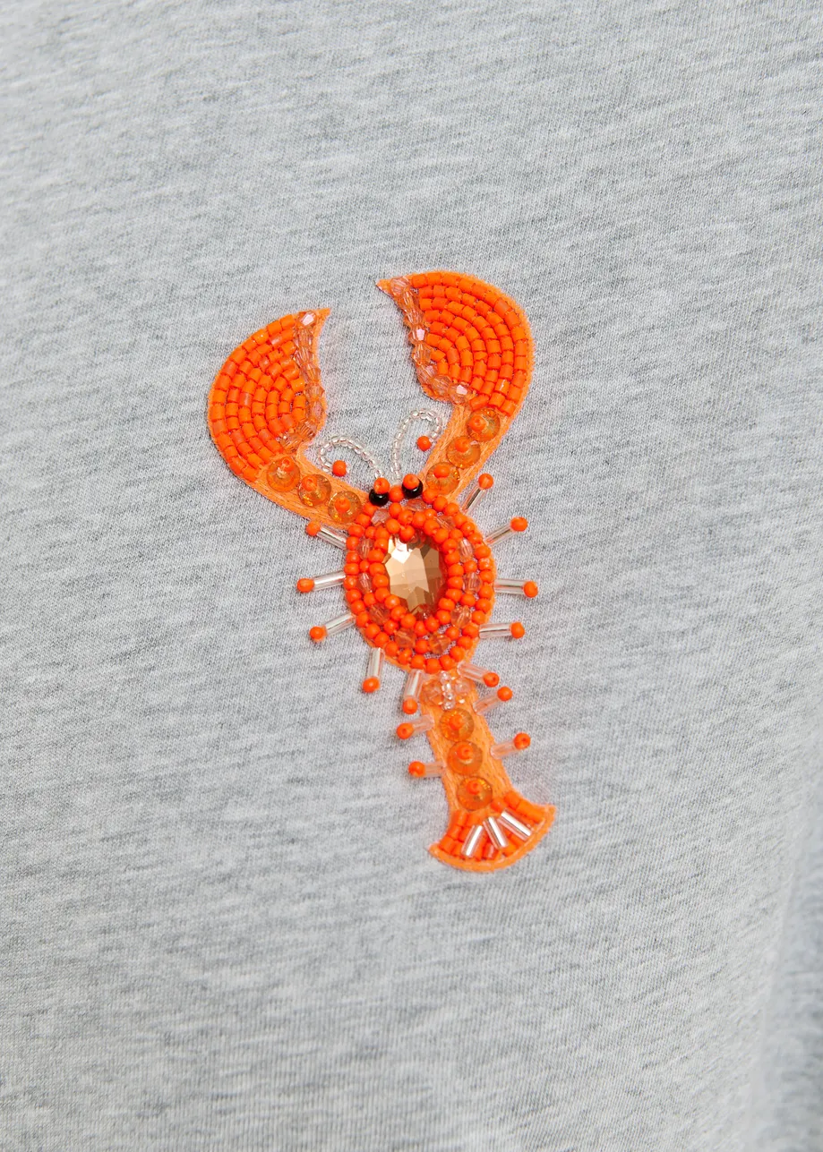 T-shirt en coton bio gris et orange à broderie