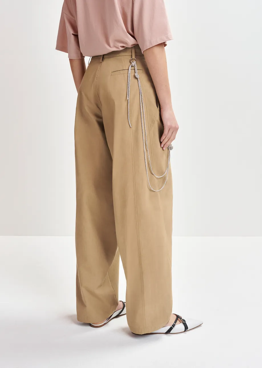 Brown tapered-leg pants with rhinestone belt