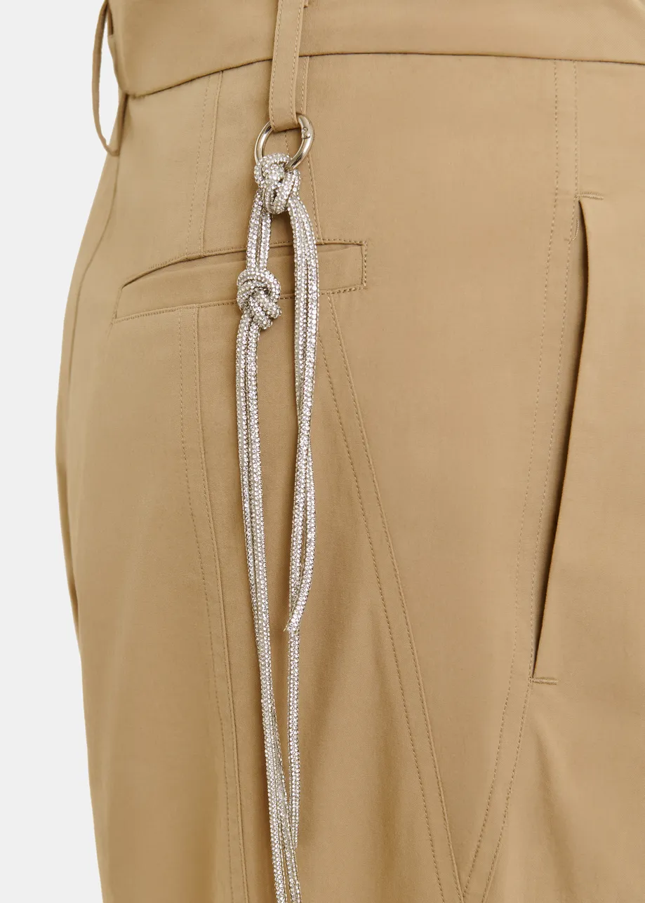 Brown tapered-leg pants with rhinestone belt