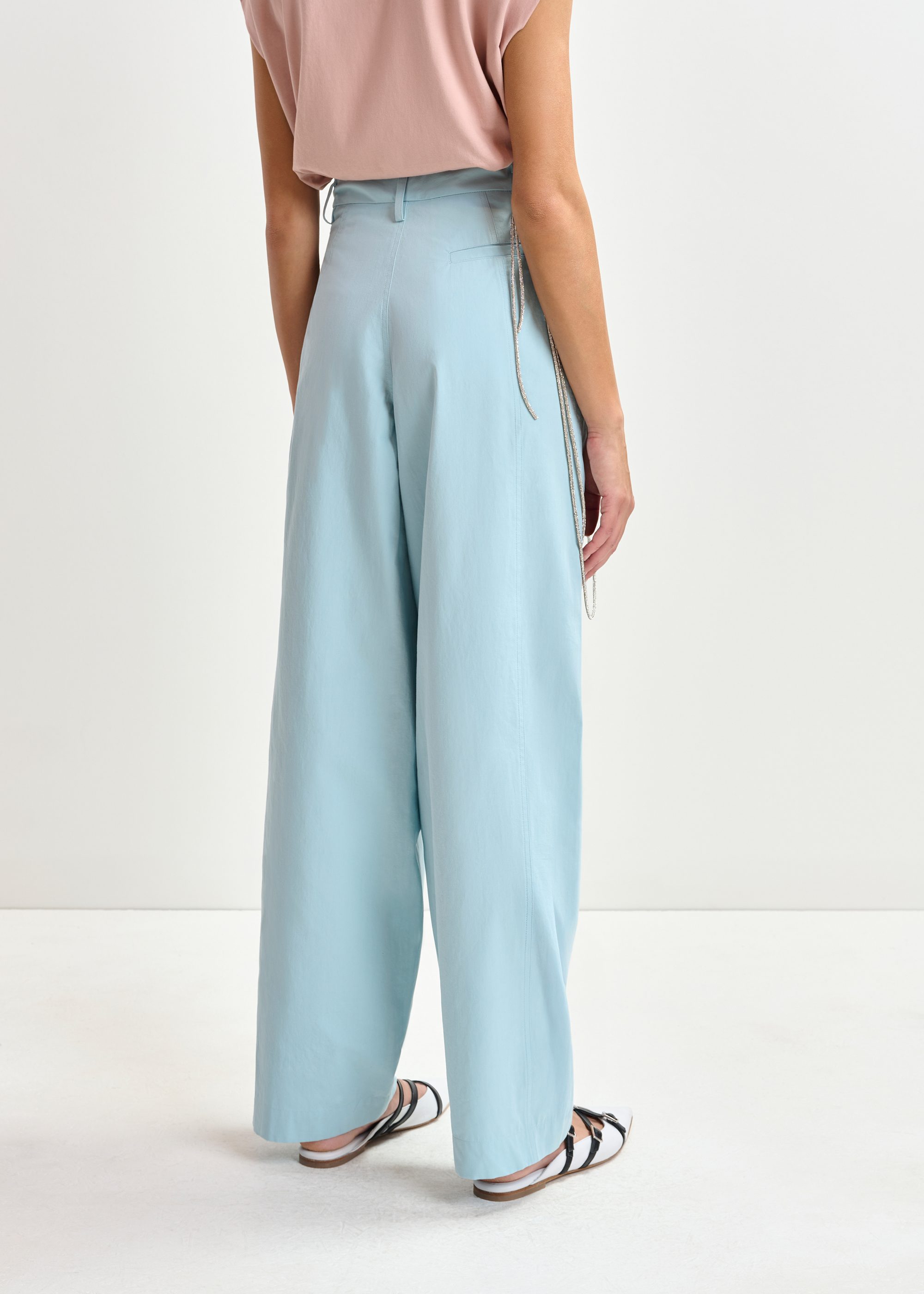 Teal tapered-leg pants with rhinestone belt | Essentiel