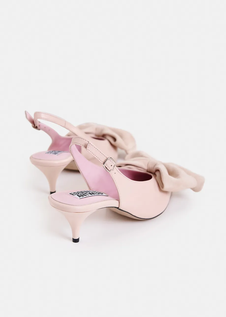 Light pink leather slingback pumps with bow detail