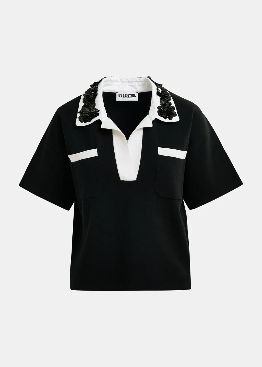 Black and white polo top with sequin and bead embellishments