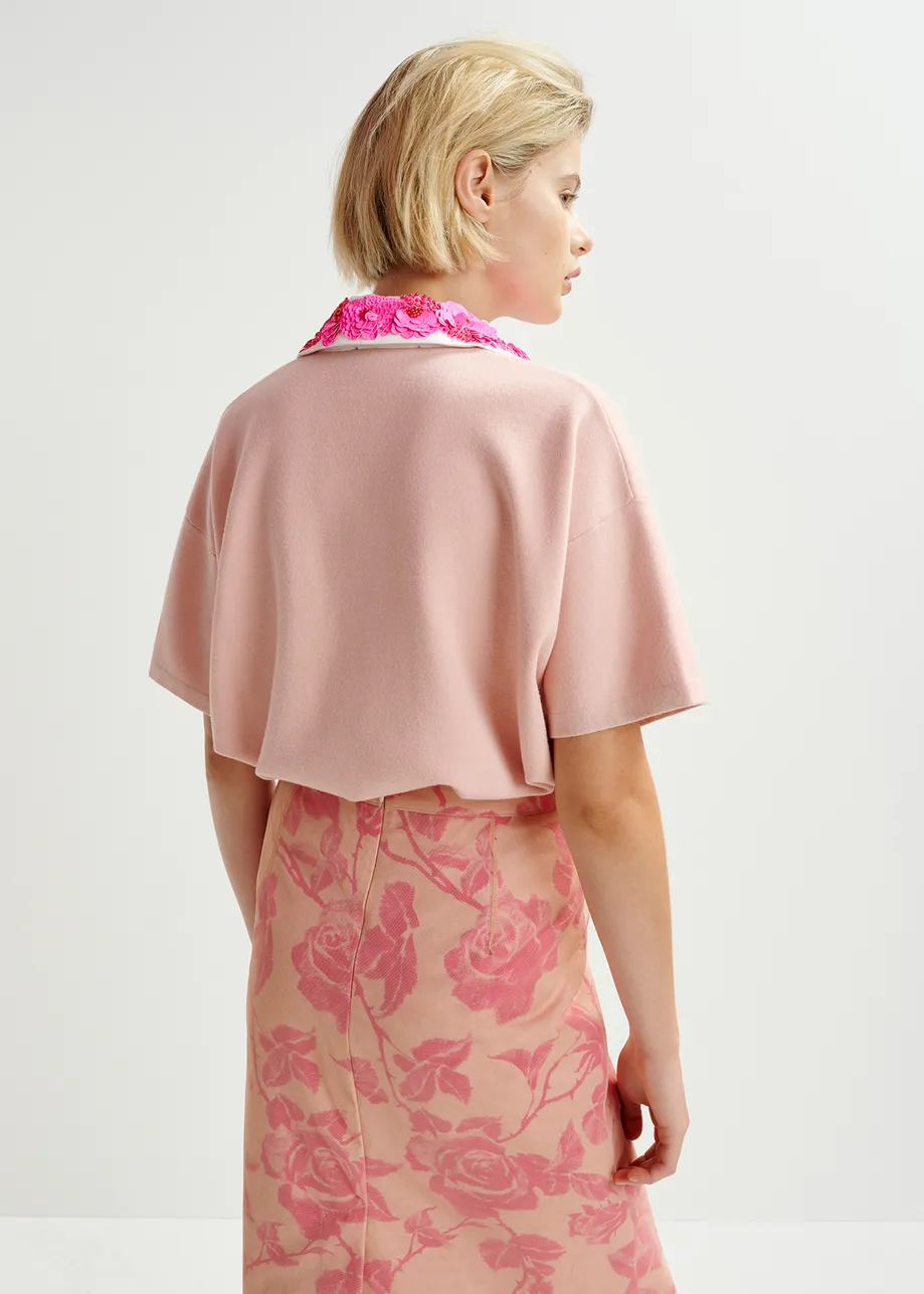 Polo rosa chiaro, rosa acceso e bianca con decorazioni di paillettes e perline