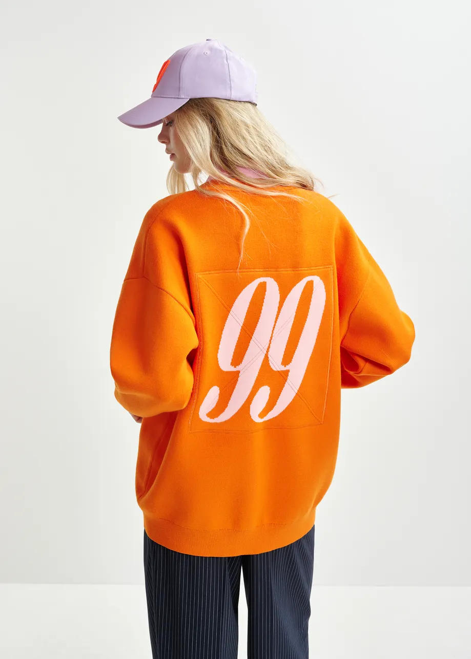 Oranje en roze cardigan met contrastboorden