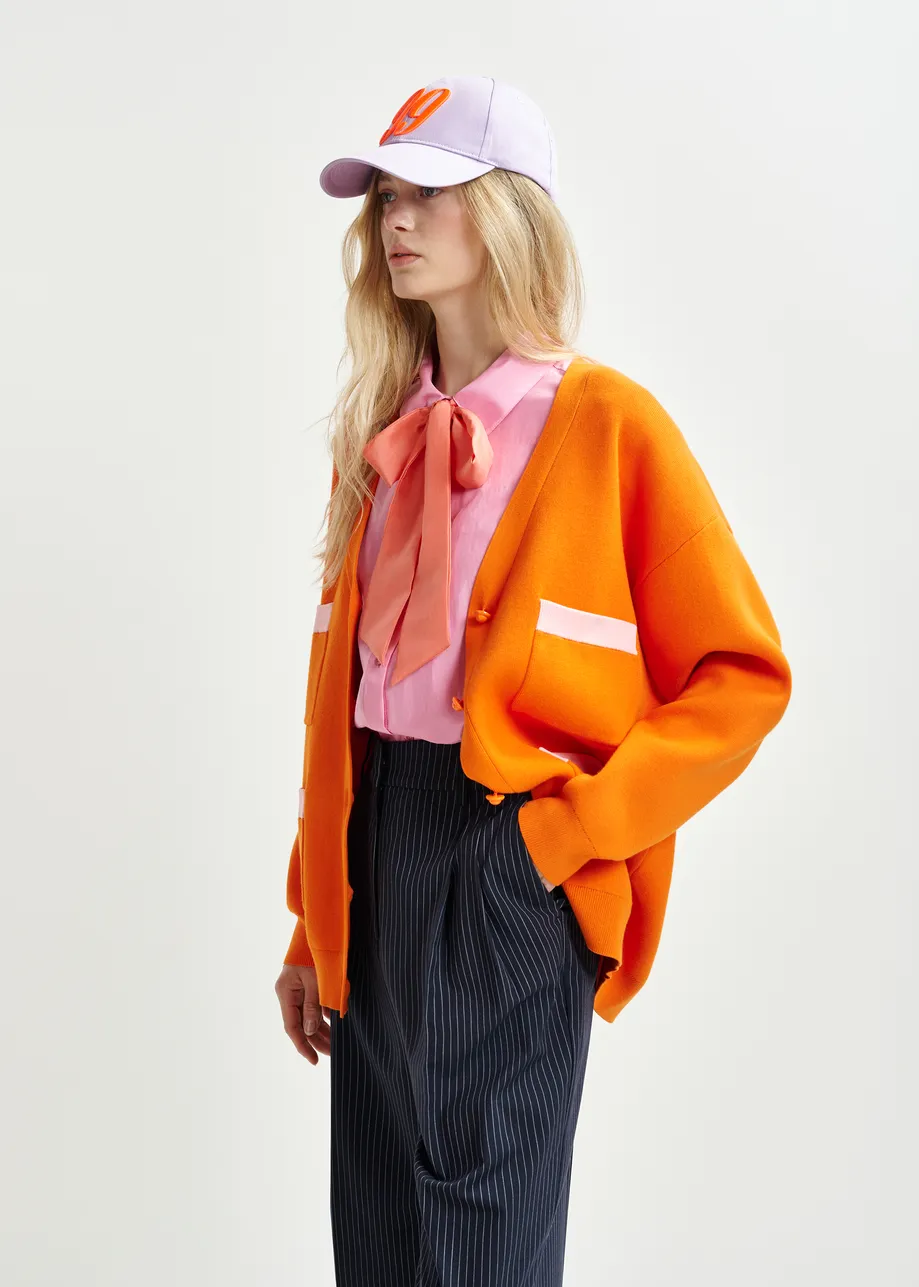 Orange and pink knitted cardigan with contrasting trims