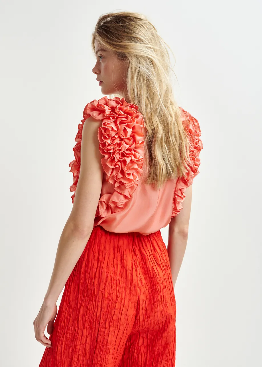 Coral silk sleeveless top with ruffles