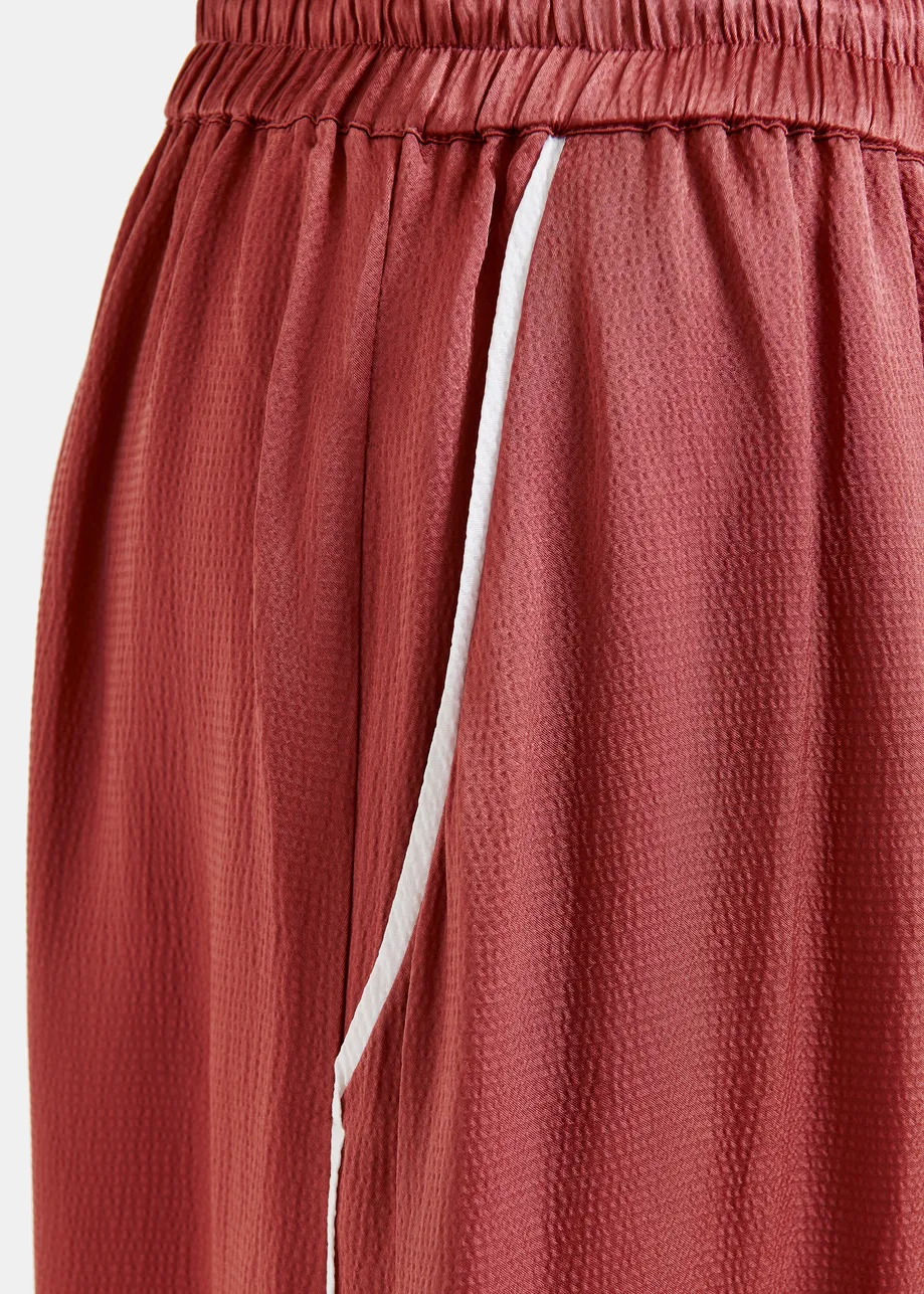 Rust red wide-Leg pants with contrast stitching