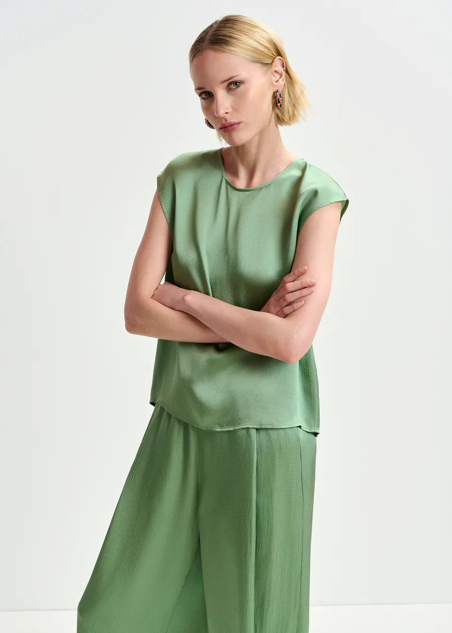 Green sleeveless top