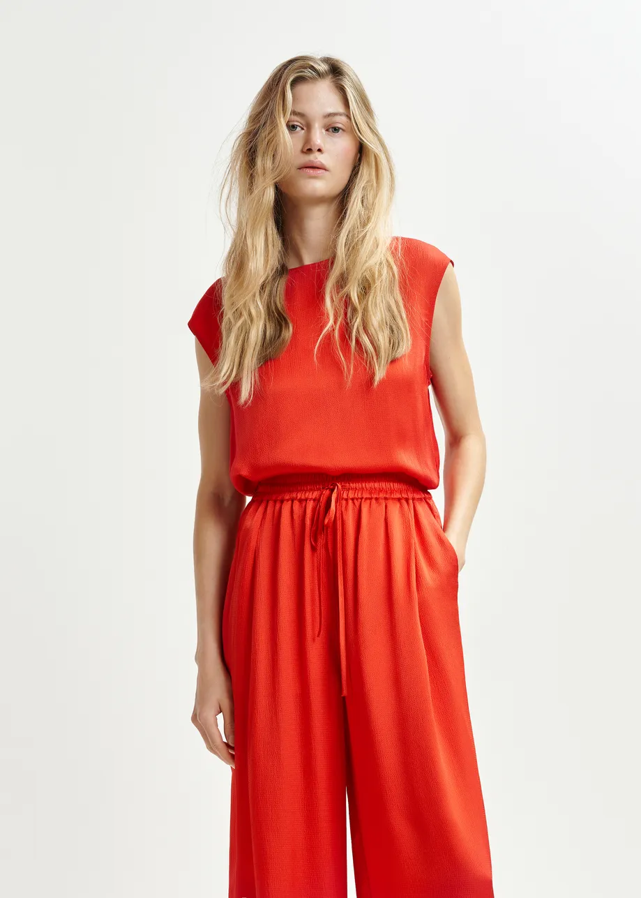 Red sleeveless top