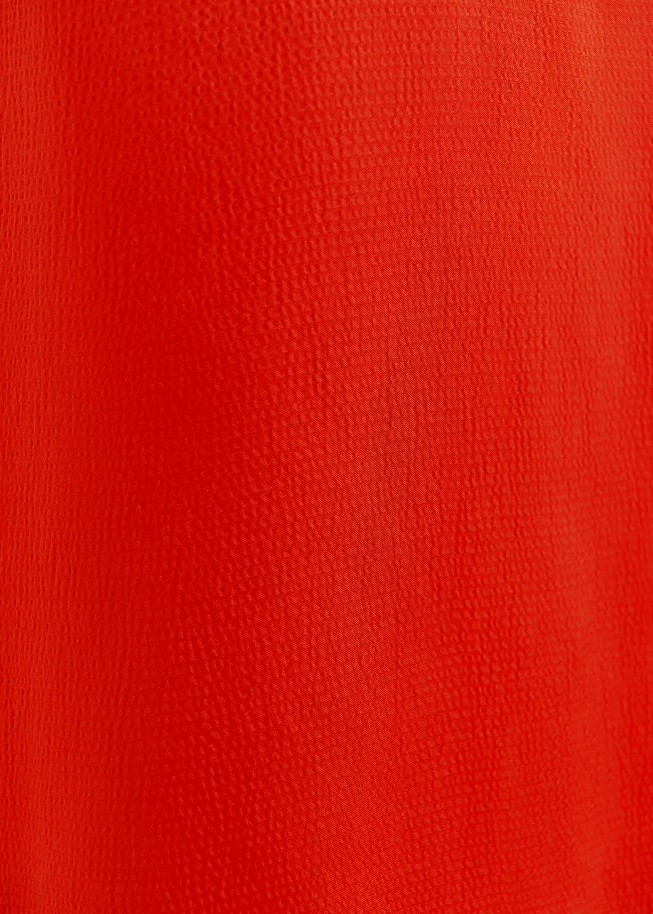 Red sleeveless top