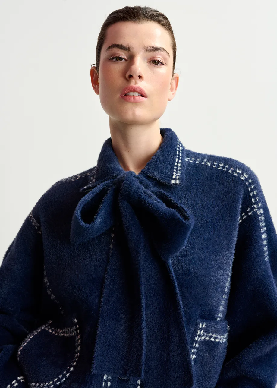 Dark blue knit with contrasting stitching and self-fabric scarf