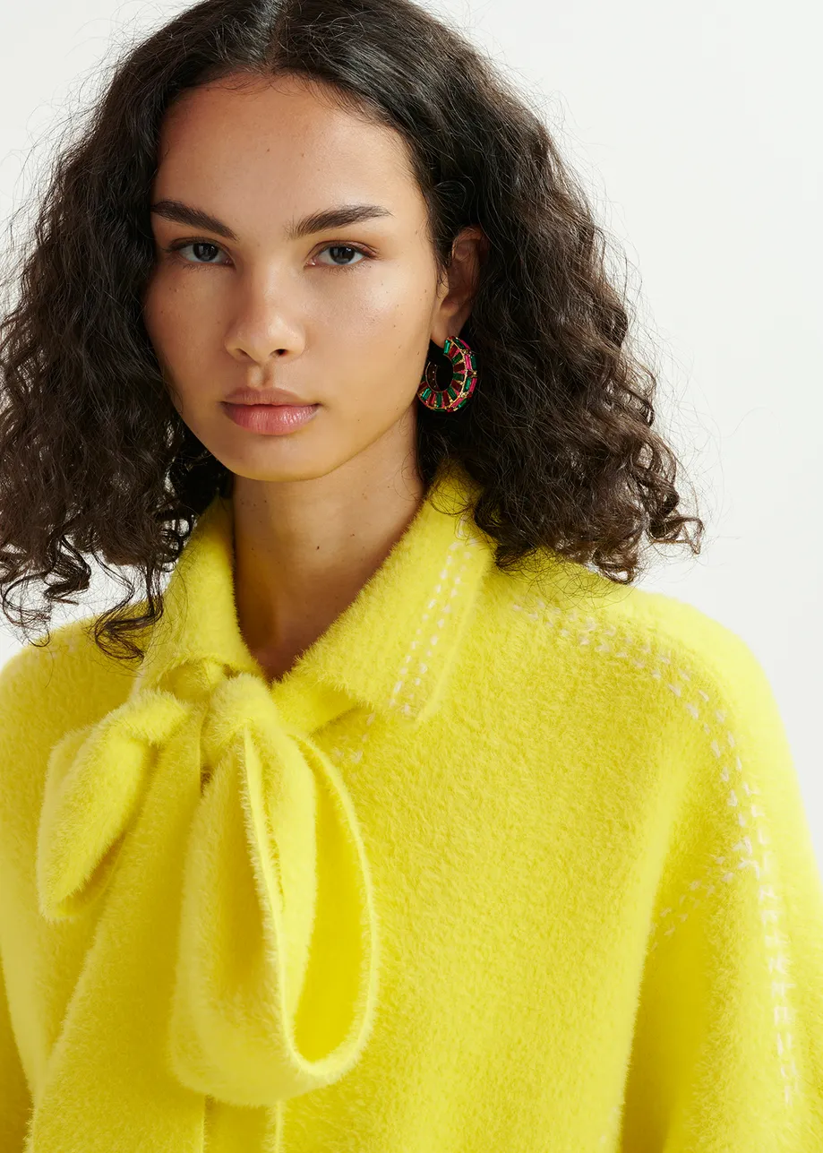 Yellow knit with contrasting stitching and self-fabric scarf