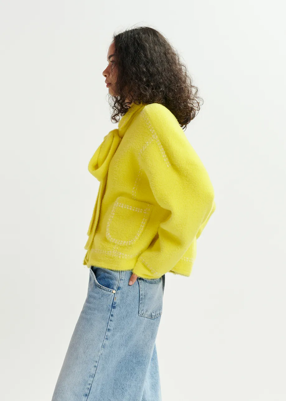 Yellow knit with contrasting stitching and self-fabric scarf