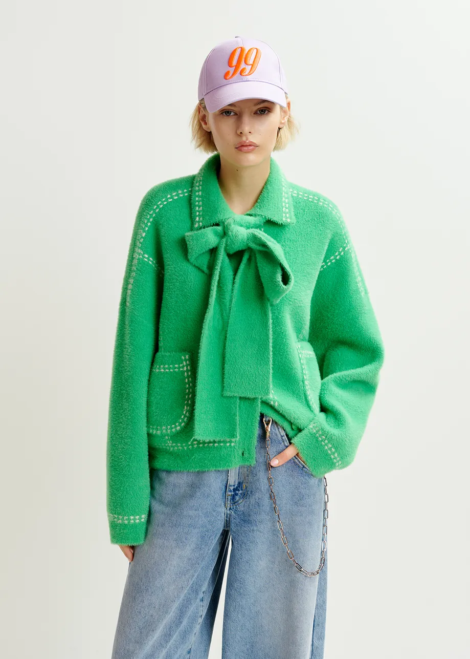 Green knit with contrasting stitching and self-fabric scarf