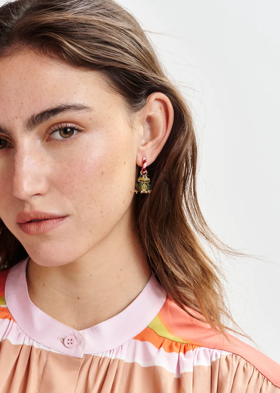 Pink and burgundy hoop earrings with frog and chair pendants