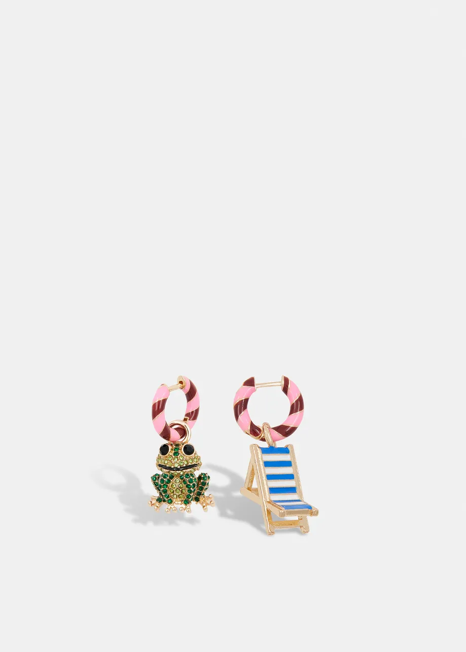 Pink and burgundy hoop earrings with frog and chair pendants