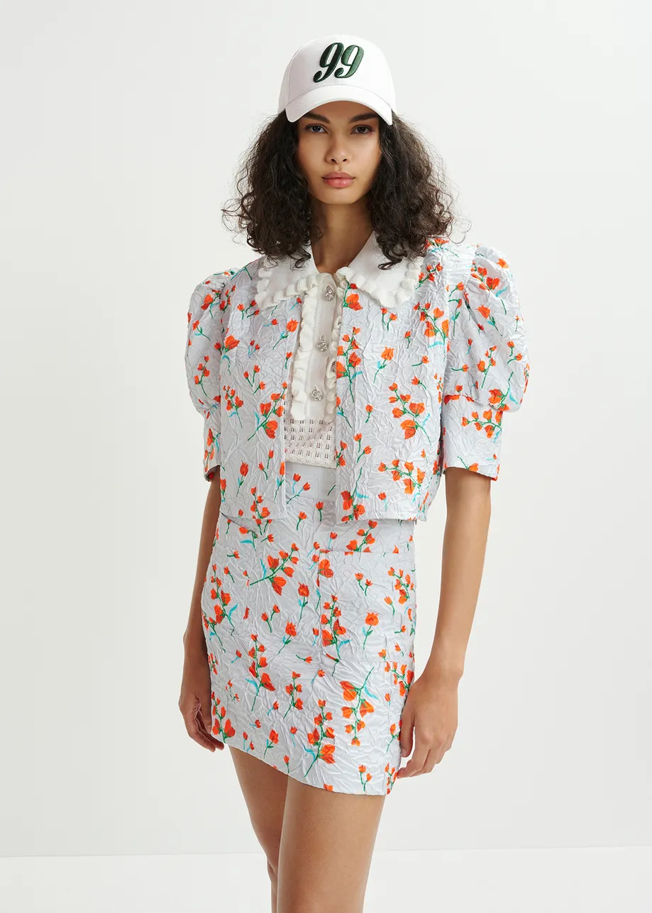 Veste courte blanche à imprimé fleuri et épaules bouffantes