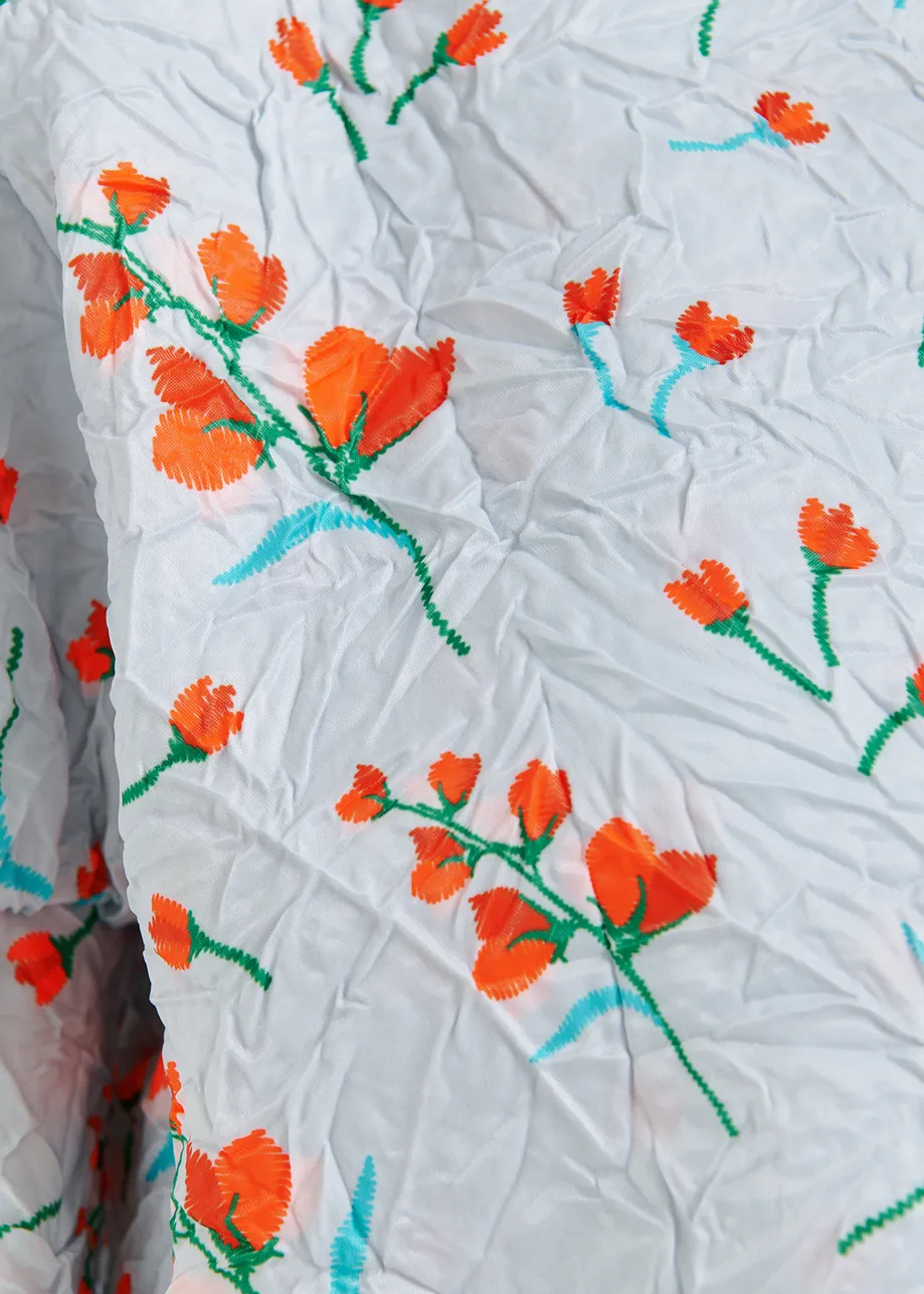 Veste courte blanche à imprimé fleuri et épaules bouffantes