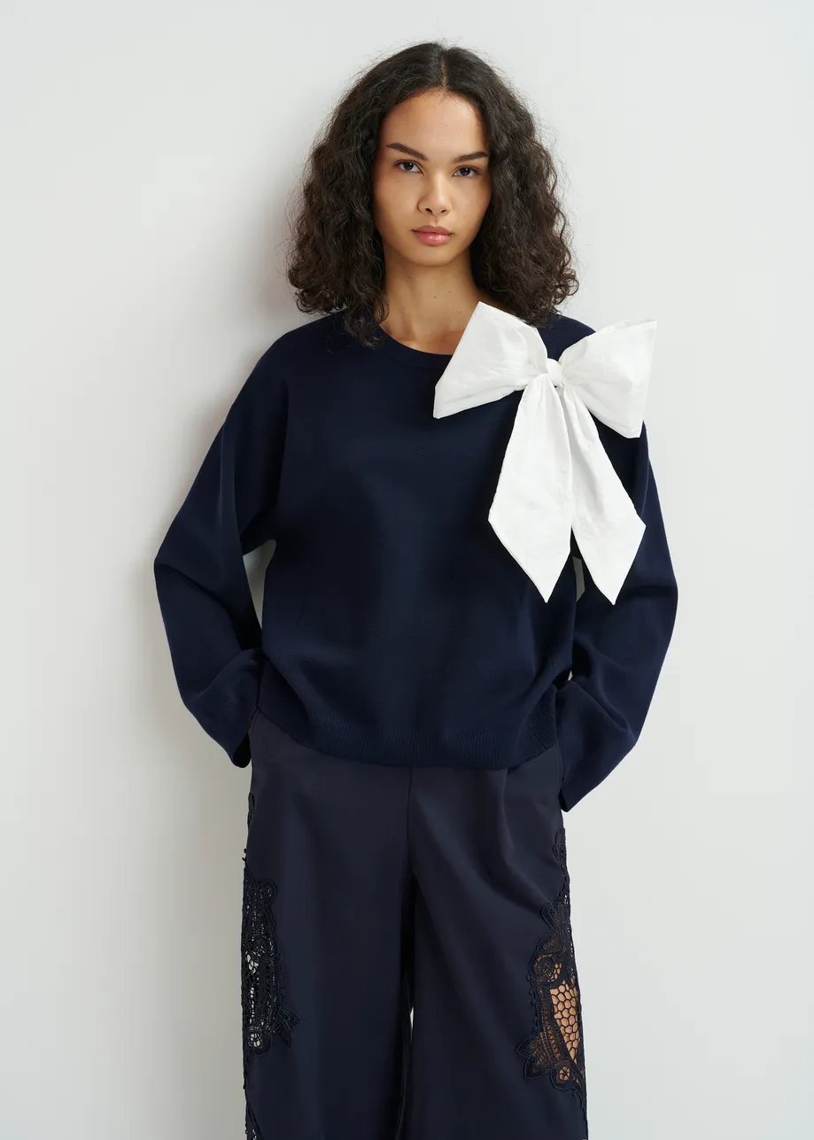  Dark blue and white sweater with removable bow detail