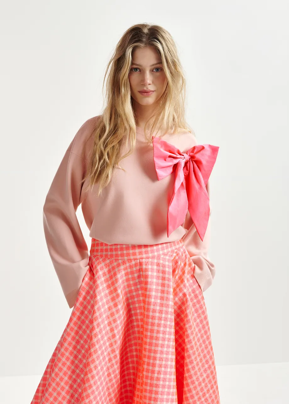 Dusty pink and bright pink sweater with removable bow detail