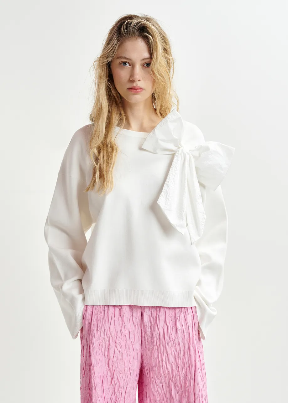 White sweater with removable bow detail