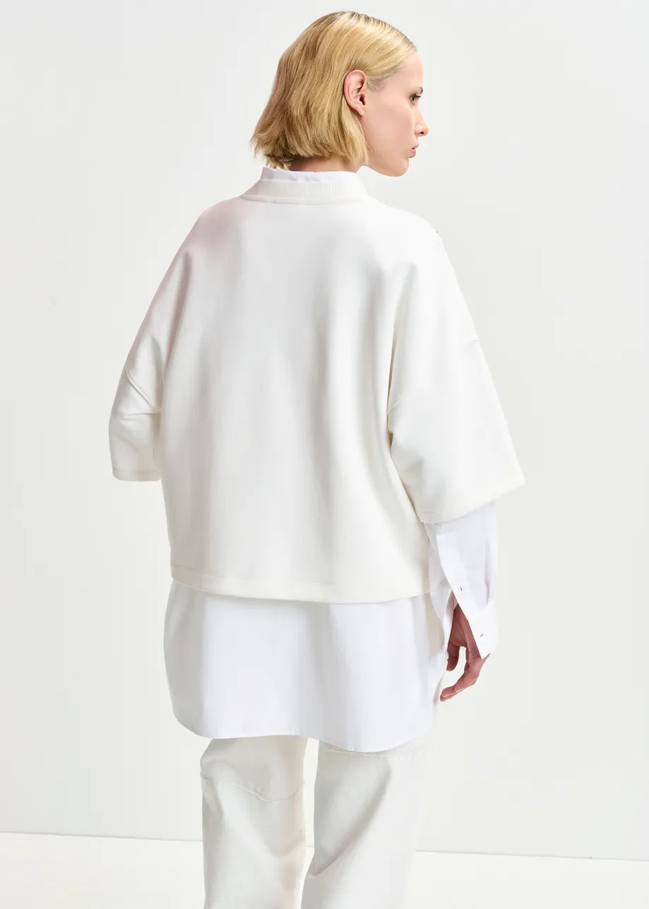 Witte biokatoenen sweater met pailletten